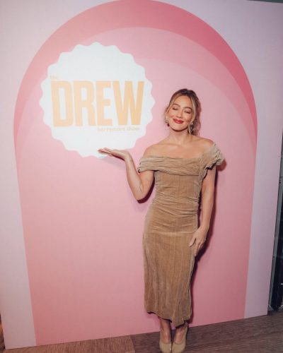 Hilary Duff wearing soft beige dress