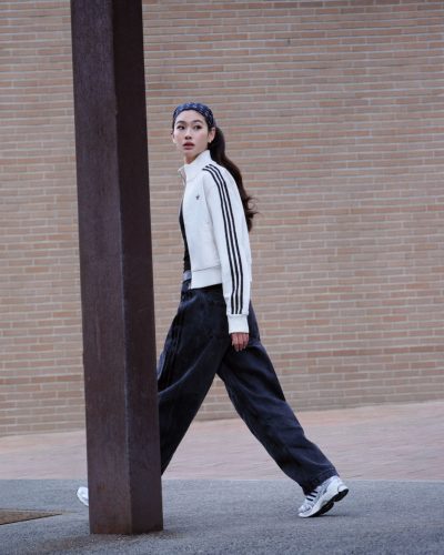 Hoyeon Jung wearing casual top under blue tracksuit jacket