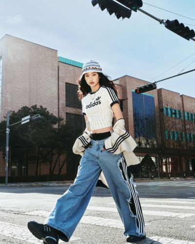 Hoyeon Jung in blue tracksuit jacket and denim pants