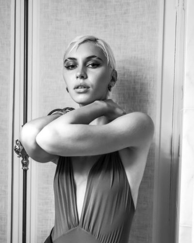 Iris Law in fitted gown with modern design details