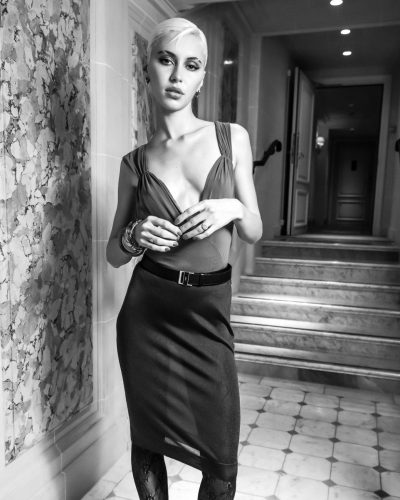 Iris Law in modern gown with striking neckline design