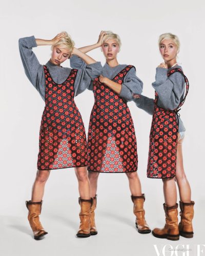 Iris Law dressed in pastel pink dress with floral motifs