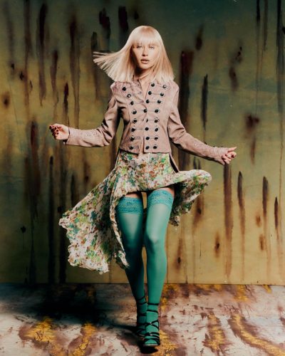 Iris Law stylish sunglasses worn with floral dress