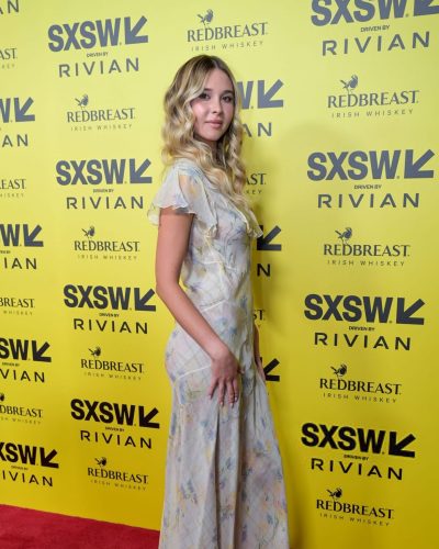 Isabel May wearing stylish look at premiere 2026