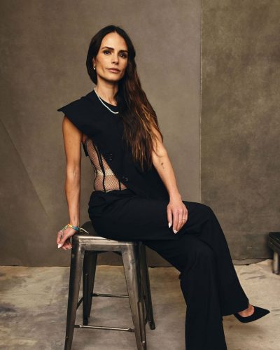 Jordana Brewster sheer side panel black dress with vibrant accessories