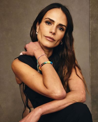 Jordana Brewster black dress featuring unique asymmetric shoulders