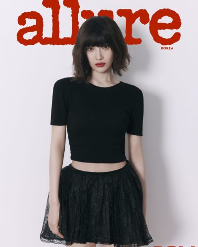 Joy in contemporary black crop top and lace skirt.