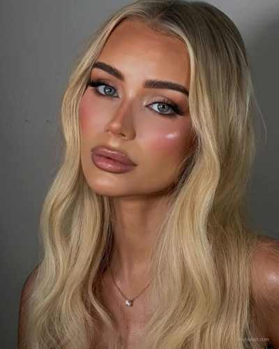 Julia Cavanagh wearing animal print bikini, perfect for summer adventures.