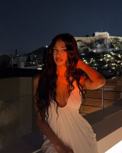 Kaaviya Sambasivam in sleek ponytail and bold lipstick