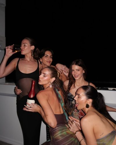 Kari Riley in a brown bikini reflecting minimalist swimwear trend.