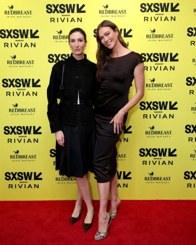 Karlie Kloss black silk gown with subtle shine under lights