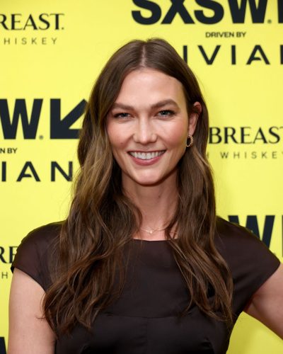 Karlie Kloss minimalist black dress with impactful accessories
