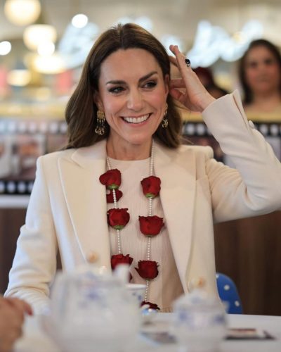 Kate Middleton cream coat with tailored lines and floral garland