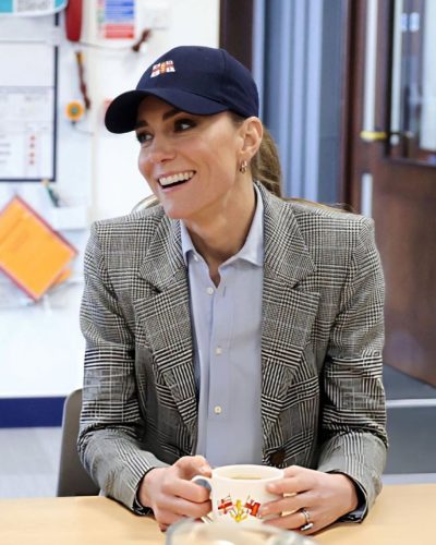 Kate Middleton in casual attire with professional blazer contrast