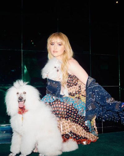 Kathryn Newton wearing bold floral gown with intricate details