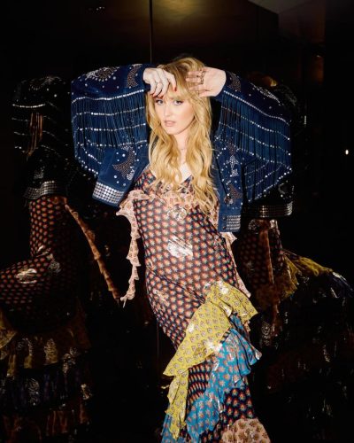 Kathryn Newton wearing bold floral gown with intricate details