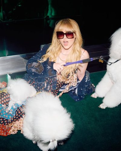 Kathryn Newton in vibrant dress complemented by soft makeup