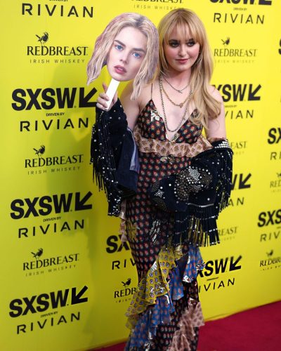 Kathryn Newton soft waves hairstyle framing her face.