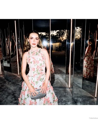 Kiernan Shipka flowing pink dress adorned with floral patterns