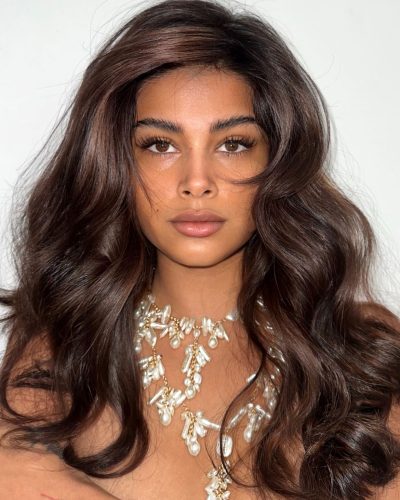 Komal Ilsanker in a vibrant patterned dress with playful textures