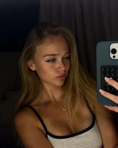 Kyla Dodds in eye-catching red bikini with beach accessories