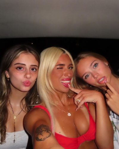 Kyla Dodds wearing red bikini with beads at the waist