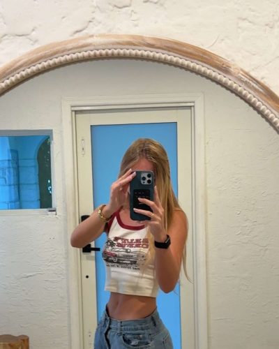 Kyla Dodds stylish high-heeled sandals complementing bright dress