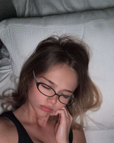 Kyla Dodds sporting a grey hoodie and black joggers.