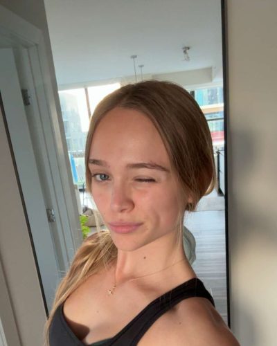 Kyla Dodds wearing a casual white dress with flowing fabric.