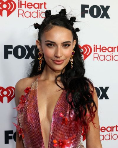 Kylie Cantrall vibrant floral dress with playful fringe elements