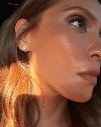 Lesley-Ann Brandt in a white gown with intricate lace details