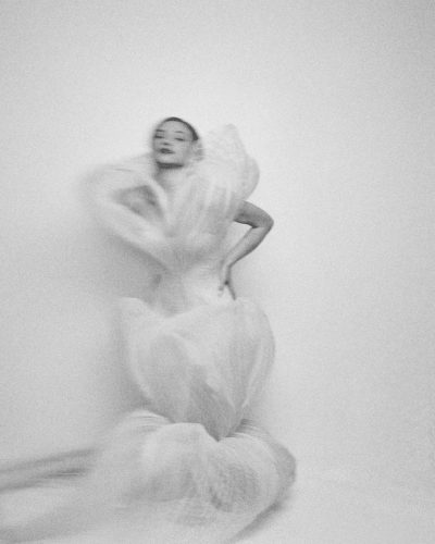 Lili Reinhart bold yellow dress featuring a fitted design and floral print