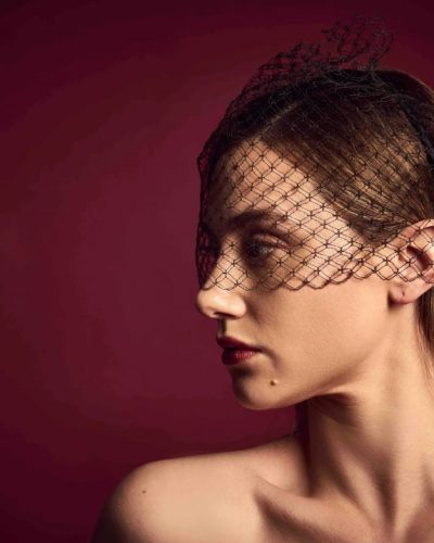 Lili Reinhart stylish yellow dress paired with shimmering gold bracelet