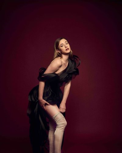 Lili Reinhart playful yellow dress with floral details and warm glow