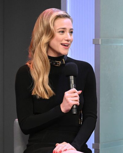 Lili Reinhart sleek black dress paired with minimal accessories.