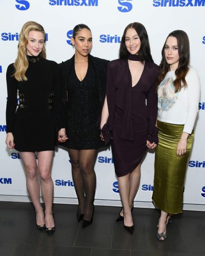 Lili Reinhart chic black mini dress with natural beauty.