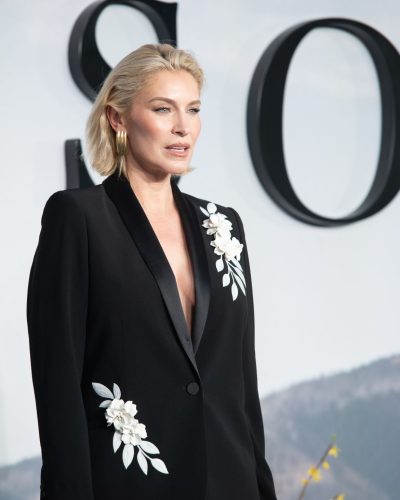 Louise Boyce black suit with white floral lapels