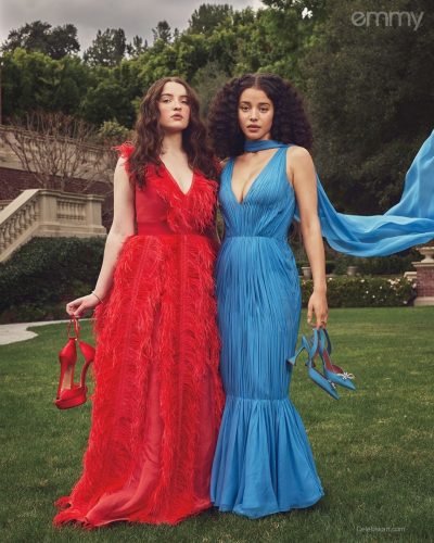 Lucy Halliday golden gown paired with elegant jewelry