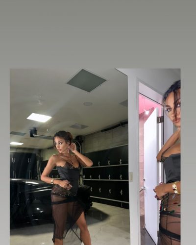 Madalina Ghenea captivating hairstyle with bold accessories