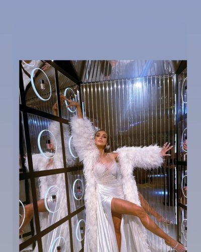 Madalina Ghenea cascading waves hairstyle with smoky eye makeup