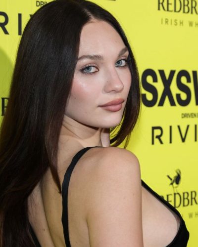 Maddie Ziegler bold black dress featuring daring cutouts