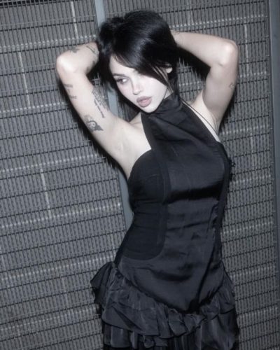 Maggie Lindemann black ruffled dress and sharp footwear