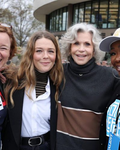 Maggie Rogers wearing a tailored black blazer with dark denim.