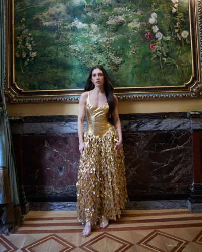 Maria Pedraza trendy mint green top paired with an orange skirt