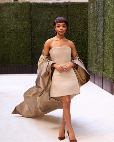 Marsai Martin wearing a fashionable strapless dress and burgundy heels