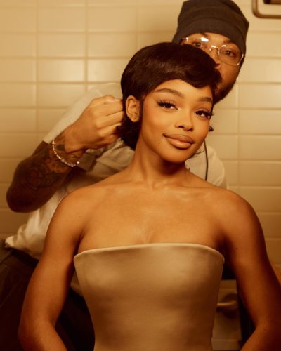 Marsai Martin in a modern beige strapless dress with heels