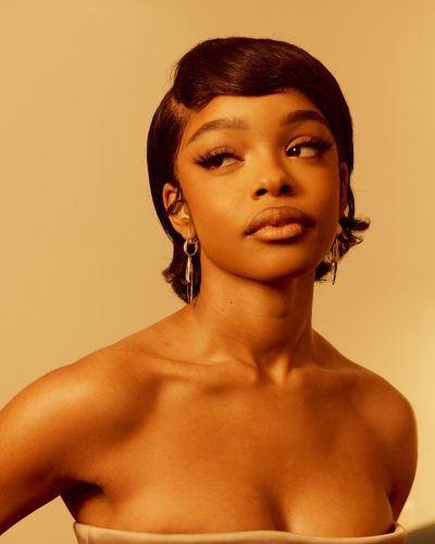 Marsai Martin in a beige strapless gown paired with burgundy heels