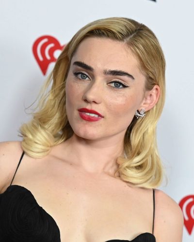 Meg Donnelly flowing black gown with delicate pleating and soft fabric