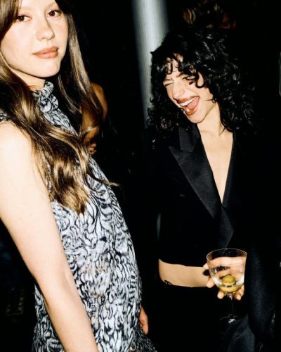 Mia Goth in floral midi dress with soft pastel colors