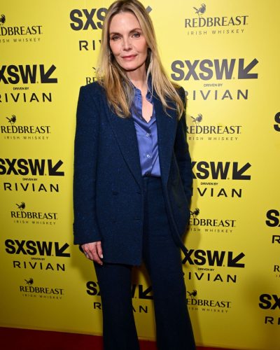 Michelle Pfeiffer in trendy navy suit with relaxed fit